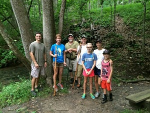 a group of kids pose for a photo during a guided hike