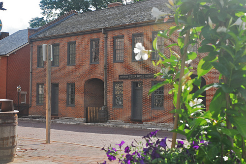 exterior of the two story, red brick first state capitol