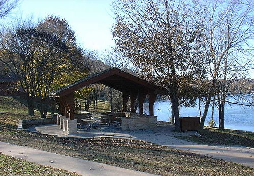 stone and wood shelter by the lake