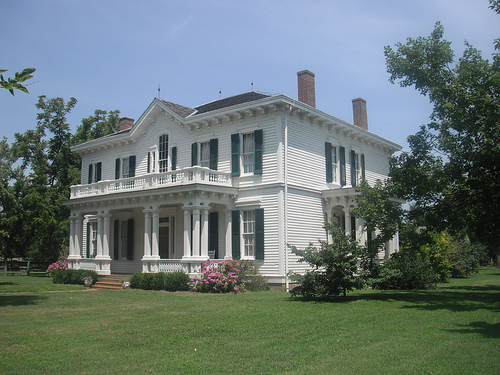 exterior of the white, two-story, large home