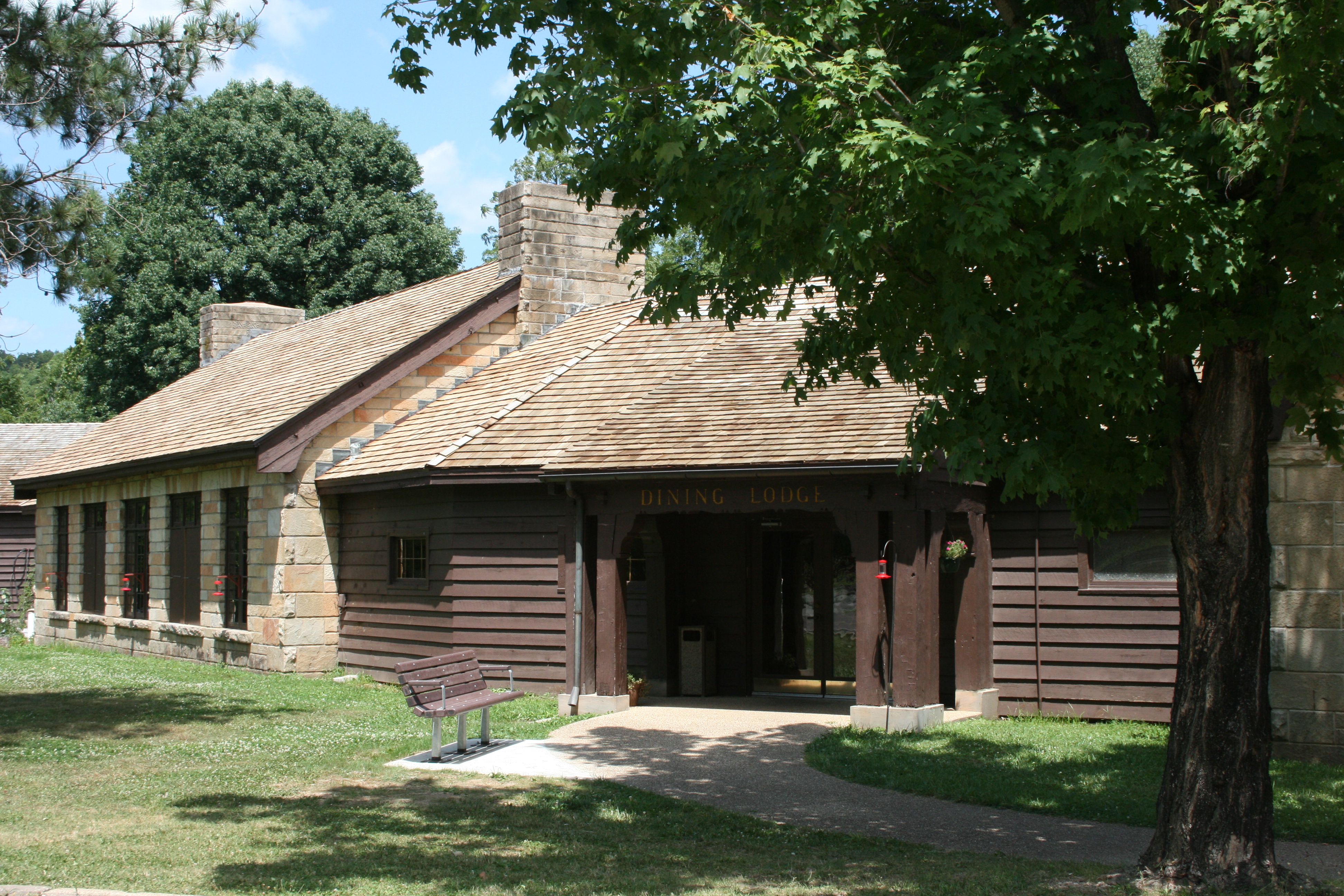 exterior of historic rock and wood dining lodge