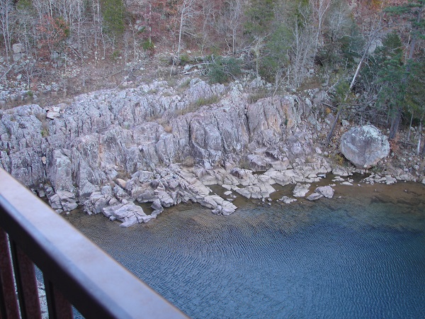 overlooking water and a rock bluff