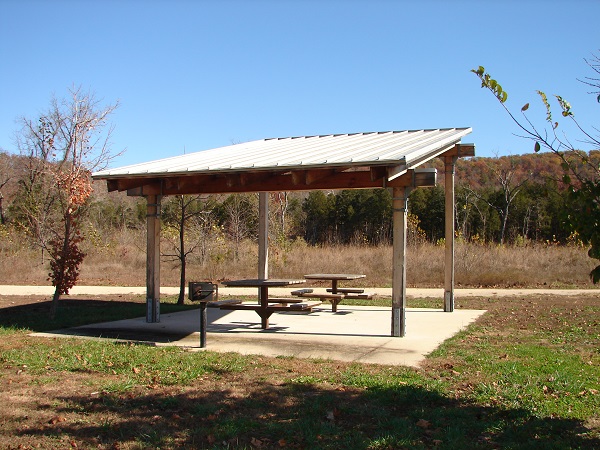 small picnic shelter with concrete pad