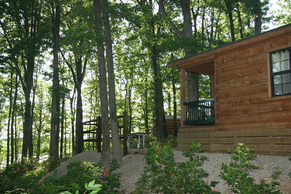 exterior of a camper cabin in the woods