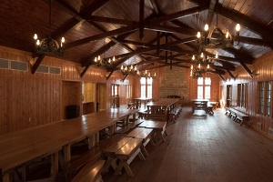 interior of open space with some tables inside the lodge