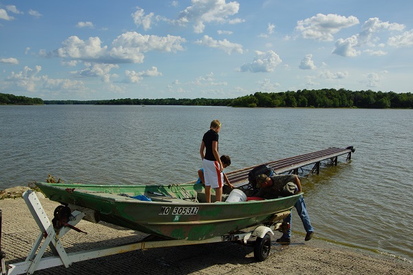 people launching a fishing boat