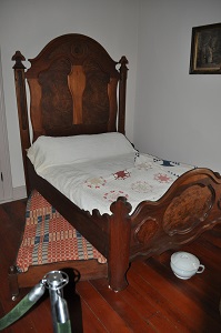 a bed with a trundle bed inside the home