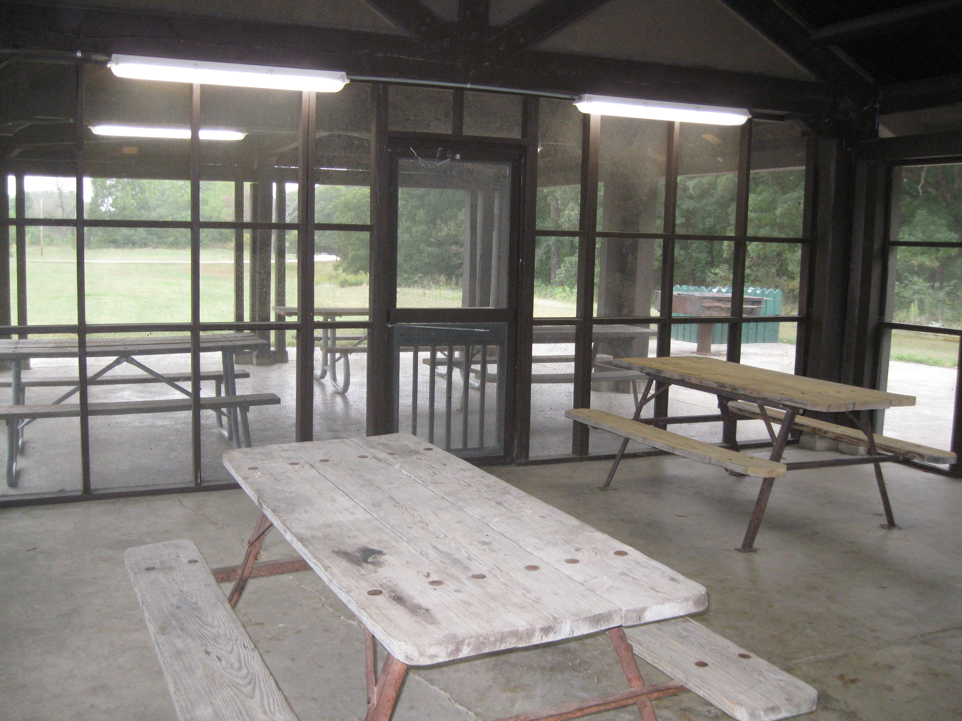 Picnic tables inside the open shelter