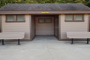 exterior of change house with two benches in front