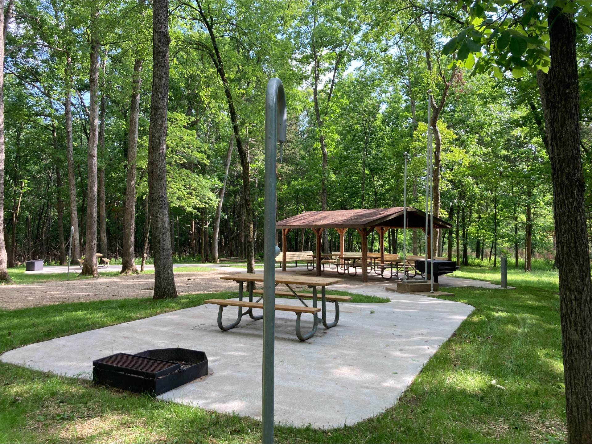Water spigot, picnic tables, and covered meeting area