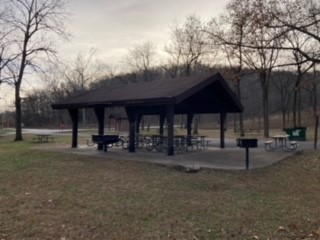 Open picnic shelter with grills and tables