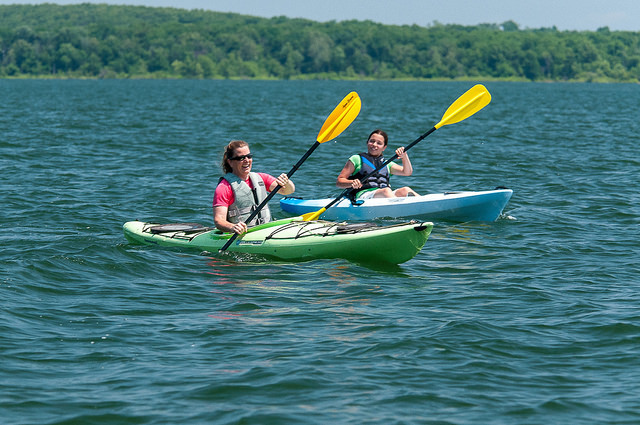 Two people kayaking on a lake