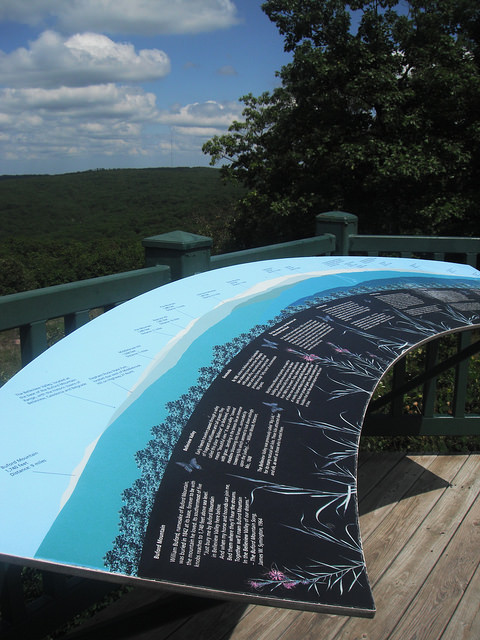 interpretive panels on the overlook describing the mountains in the distance