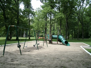 swing set and playground equipment with a slide