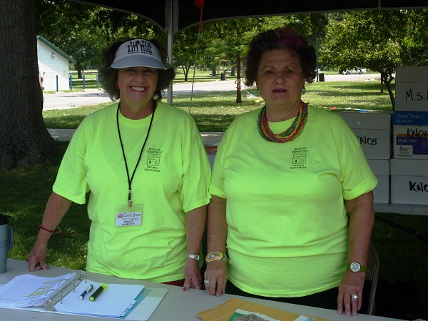 two women volunteers helping at the information booth on the Katy Trail Ride