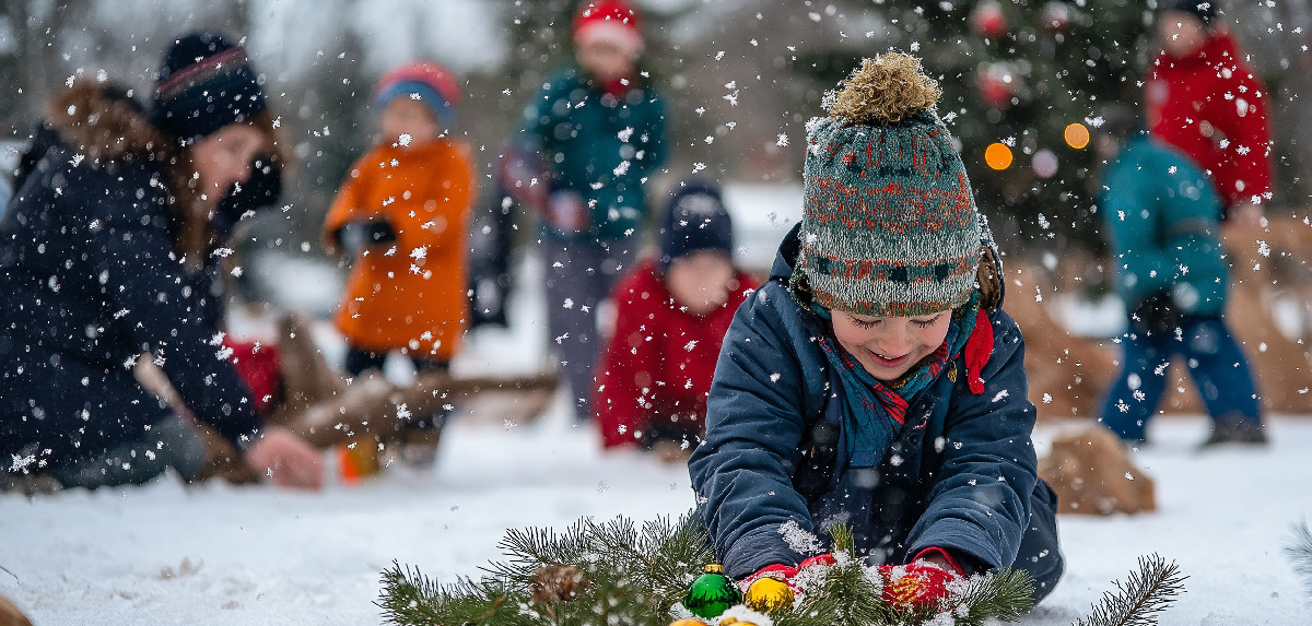 Small child playing in snow 