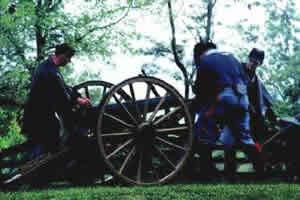 soldiers load a canon at a battle re-enactment event
