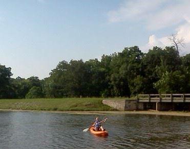 person kayaking on the lake